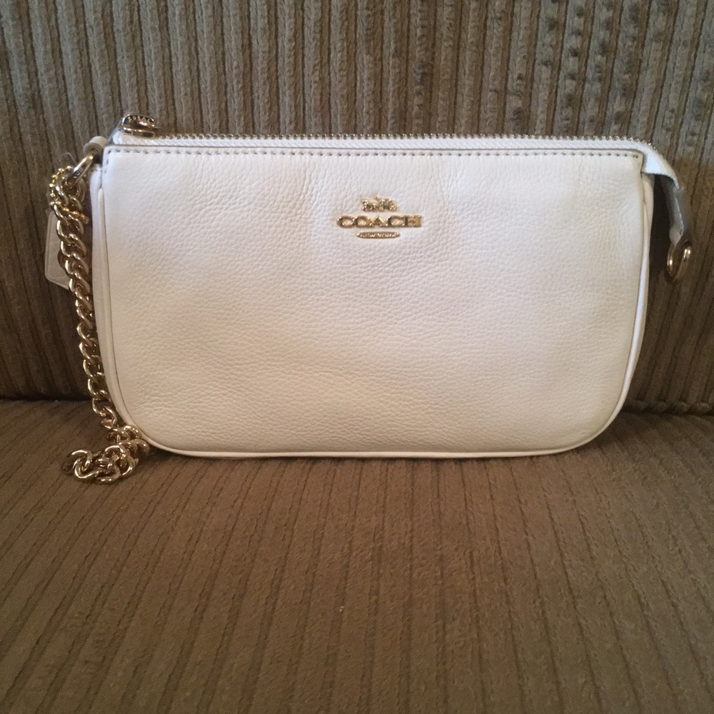 Coach wristlet brand new.  Cute chain for handle